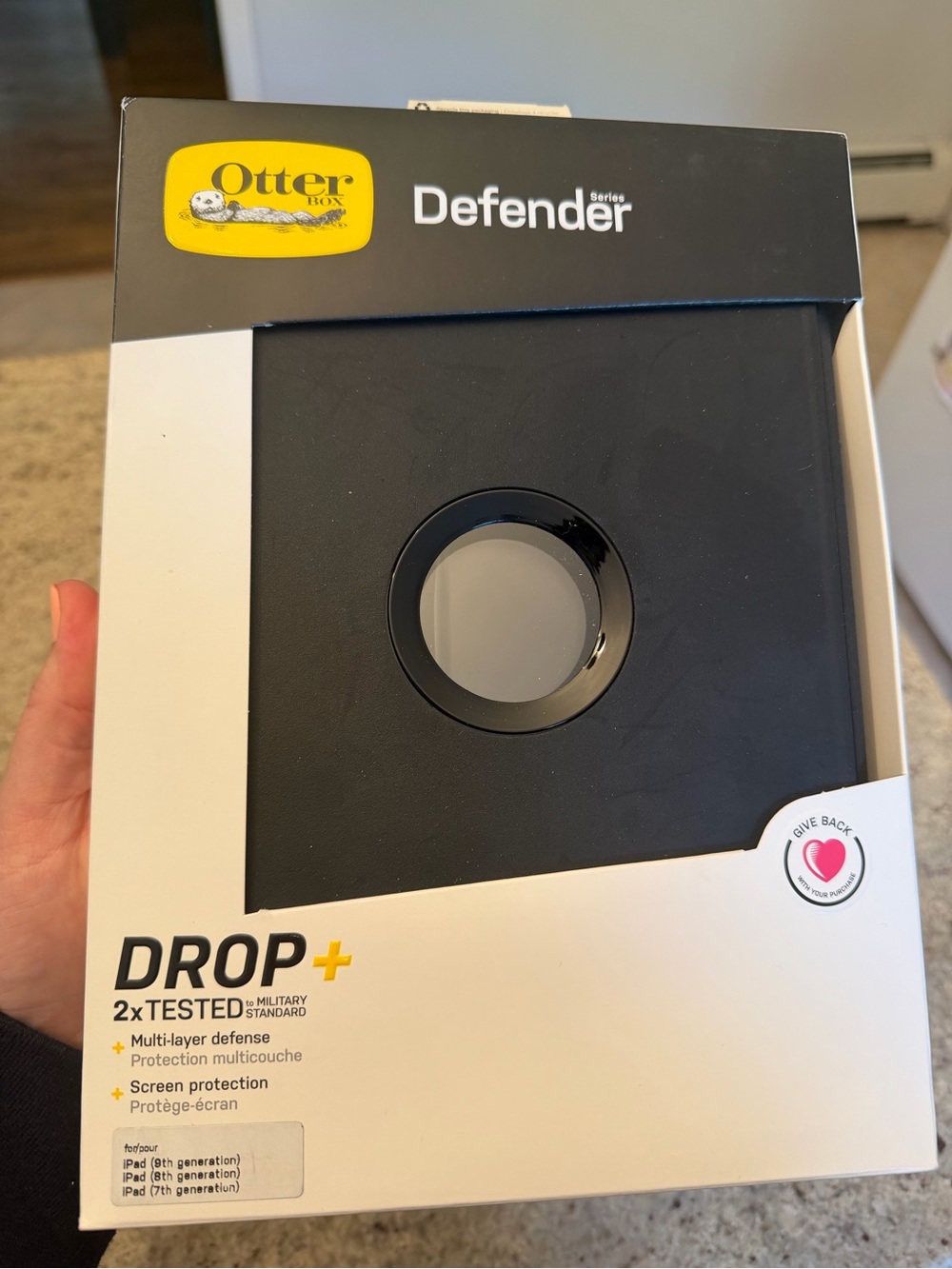 OtterBox iPad Case Packaging in Black and White with Yellow Accent